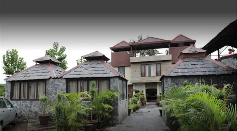 Cluster of stone cottages leading to the main resort building